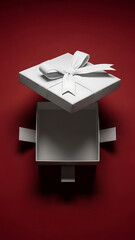 An empty white gift box with a ribbon and lid floating above, set against a vibrant red background, viewed from directly above.