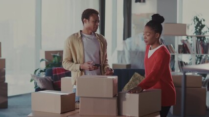 Two friends settle comfortably into new environment, Happy couple arranges belongings in inviting and lush surroundings