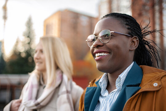Diverse friends enjoying time outdoors in city