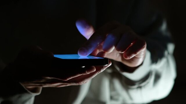 Mobile communications and online communication.
A person types a text message on a smartphone and sends it.
Scrolling through an online news feed.
Mobile communications and virtual communication