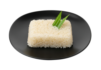 Steamed Rice on Black Plate with Pandan Leaf Garnish