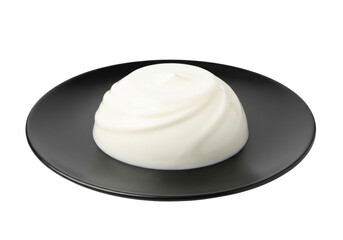 Single Portion of Milk Pudding on Black Plate