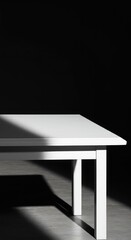 A vacant, minimalist white table with a single shadow stretching across the empty surface, emphasizing the feeling of something missing ,absence ,simplicity ,still life