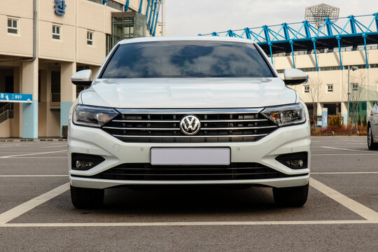 January 31, 2021, Seoul, South Korea - Front view of a white Volkswagen Jetta sedan parked in an outdoor parking lot.