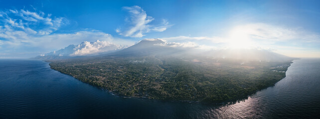 Panoramic view of coastline with volcano and in Bali