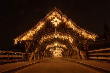 the famous historic wooden bridge of Bremgarten, Switzerland ist decorated for christmas