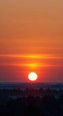 Brilliant dawn colors paint the eastern sky as the fiery sun crests the horizon, signaling a serene and hopeful new beginning ,fiery ,gold ,daybreak