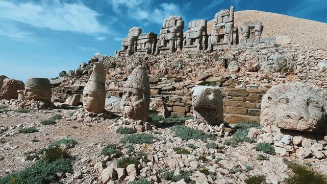 Turkey, Adiyaman, May 3, 2024: ruins at the top of Mount Nemrut. Destroyed ancient statues in the Taurus Mountains. Ancient stone heads on top of Mount Nemrut. 4К