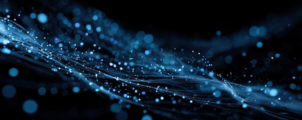 A blue-toned, abstract composition features flowing, illuminated lines and scattered bokeh on a black background