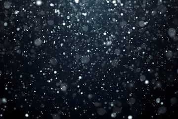 Obraz premium White bokeh particles and glowing dust on dark blue background