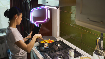 AI powered digital assistant displayed on tablet supporting cooking process in modern kitchen environment. Concept of artificial intelligence, smart interfaces, contextual help, digital lifestyle.