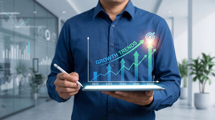 A businessman's hand uses a finger to touch a digital tablet screen, displaying a world map and graph concept for future global business network communication and internet connection technology