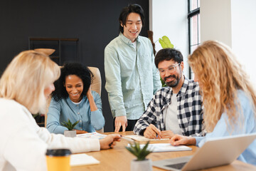 Fototapeta premium Diverse group of multinational business team collaborating during office meeting, brainstorming