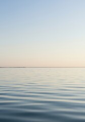 Obraz premium Empty clear water surface reflecting pale sky, perfect background for spiritual tranquility or design overlay or copy space ,serene ,clear ,smooth