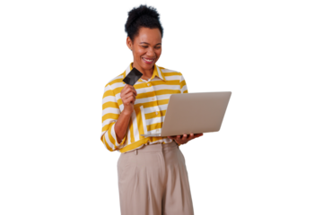 Woman smiling while shopping online, holding credit card and laptop, enjoying secure digital payment experience