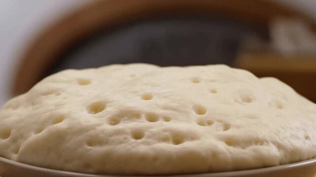 Rising dough: timelapse of yeast fermentation and expansion in baking process