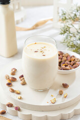 Indulge in a creamy hazelnut milkshake with a side of crunchy nuts, perfect for a healthy dessert or snack