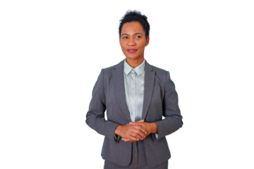 Confident black businesswoman standing, looking away with crossed hands, wearing a formal suit