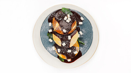 Top view of traditional cottage cheese pancakes syrniki served with sour cream, berry jam, and mint