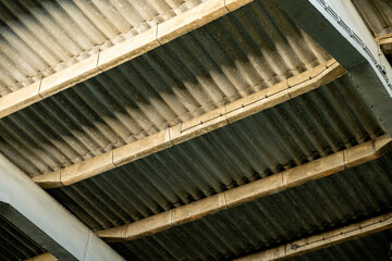 Steel roof insulation applications. Old concret with light and shadow concept.Heavy condensation on newly installed Onduline roof in prefab garage. Ruins of a very heavily polluted industrial factory,