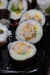 fresh sushi food with avocado, rice, sallad