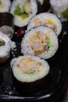 fresh sushi food with avocado, rice, sallad