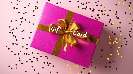 Colorful gift card box on a pink background with confetti scattered around