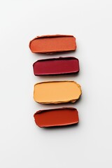 Color palette of red and orange paint swatches arranged horizontally on white background