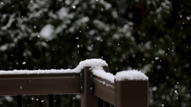 Real Falling Snow on Wooden Deck Railing Winter Background, Falling Snowflakes Winter Background.