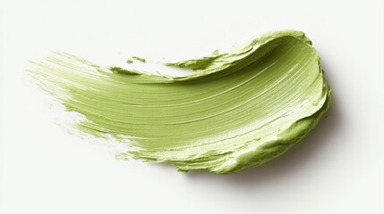 artistic matcha green paste stroke with textured edges, white background, cosmetic packaging and wellness branding concept