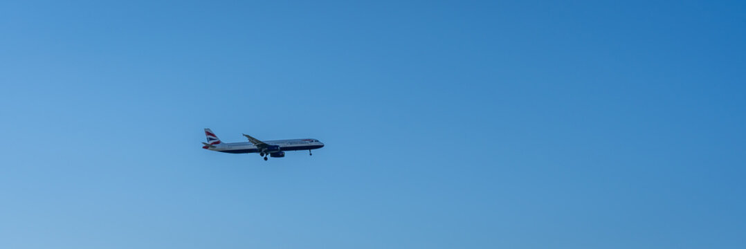 A British Airways Airbus A321 in flight before landing at Faro Airport in Portugal.