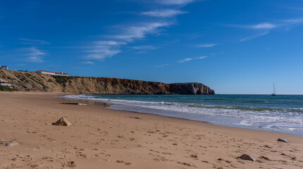 Scenic View Of Prainha das Po&ccedil;as beach and cliffs which is located in Sagres, Algarve Region of Portugal against Cloudy Sky. Located at the southwestern tip of mainland Europe.