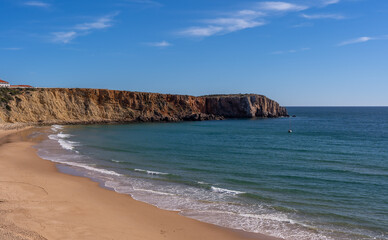 Scenic View Of Prainha das Po&ccedil;as beach and cliffs which is located in Sagres, Algarve Region of Portugal against Cloudy Sky. Located at the southwestern tip of mainland Europe.