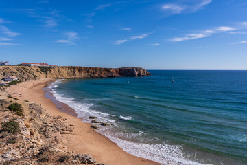 Scenic View Of Prainha das Po&ccedil;as beach and cliffs which is located in Sagres, Algarve Region of Portugal against Cloudy Sky. Located at the southwestern tip of mainland Europe.