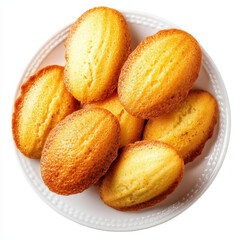Golden madeleines on white plate, showcasing their fluffy texture and inviting aroma. These classic French pastries are perfect for delightful treat