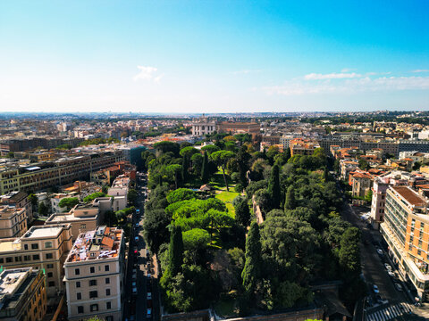 Epic Roman park aerial panorama. 
Cinematic drone view of 
Aurelian Walls greenery and 
umbrella pines in Rome, Italy. 
Historic city landscape at dawn.
