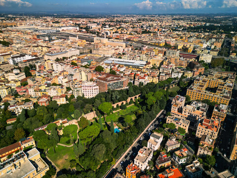 Epic ancient Roman walls panorama. 
Cinematic aerial view of 
Aurelian Walls and historic 
cityscape in Rome, Italy. 
Urban heritage reveal.
