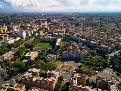 Horizontal aerial view of Basilica of the Holy Cross in Jerusalem and Aurelian Walls. Historic cityscape of Rome, Italy.
