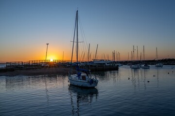 sunset over boats in the harbour at Hill Head Hampshire England