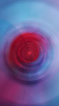 Red abstract radial burst with vibrant gradient light effects and dynamic motion &ndash; vertical backdrop for energetic visual content