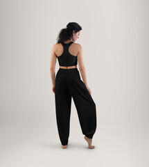Mockup of black wide pants yoga, top on a woman, full height back view, isolated on background.