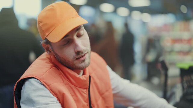 Retail worker handles long hours, Clerk processes customer purchases while displaying tireless dedication and focus