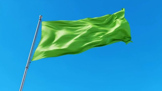 Vibrant Green Flag Waving in Clear Blue Sky on Metal Pole Outdoor Scene waving flag