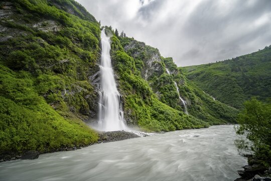 Horsetail Falls waterfall on the Lowe River in a green gorge, long exposure, Keystone Canyon, Richardson Highway, Alaska, USA