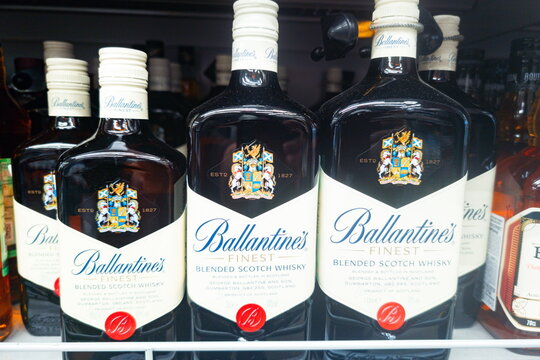 Bottles of Ballantine's finest blended scotch whisky on a store shelf in a liquor store