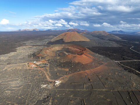 Monta&ntilde;a Quemada and Monta&ntilde;a Pedro Perico volcanoes, volcanic landscape with craters and lava fields, aerial view, Lanzarote, Canary Islands, Spain