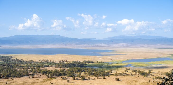 View of savanna landscape and lakes in the Ngorongoro Crater from the crater rim in the evening light, Ngorongoro Conservation Area, Tanzania