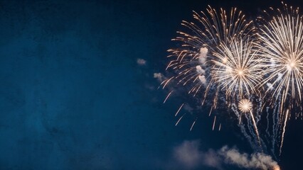 Colorful fireworks bursting in the night sky with a textured blue background
