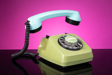Retro Rotary Telephone with Taken off Receiver. Vintage Communication Concept, Classic Landline Handset, Nostalgic Technology, Creative Pop Art Style Still Life