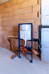 Concealed Wall Hung Toilet Frame Installation in New Bathroom Under Construction, Plumbing Pipes and In-Wall Cistern System for Modern Home Renovation